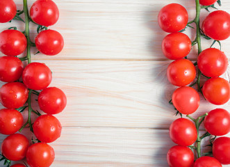 Cherry tomatoes on the white wooden table
