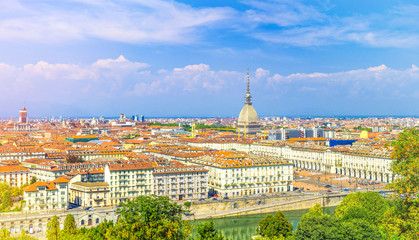 Obraz premium Aerial top panoramic view of Turin city center skyline with Piazza Vittorio Veneto square, Po river and Mole Antonelliana building with high spire, blue sky white clouds background, Piedmont, Italy