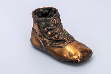 Bronzed Baby Shoe on white background