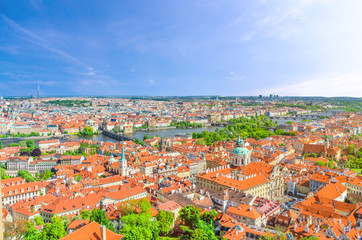 Fototapeta na wymiar Top aerial panoramic view of Prague historical city centre with red tiled roof buildings in Mala Strana Lesser Town and Old Town, Charles Bridge Karluv Most over Vltava river, Bohemia, Czech Republic