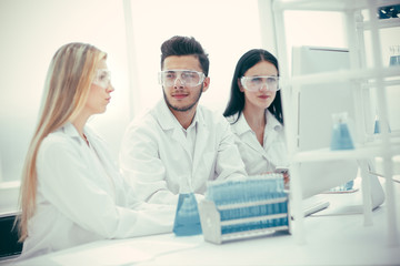 group of doctors are working with tests for coronavirus