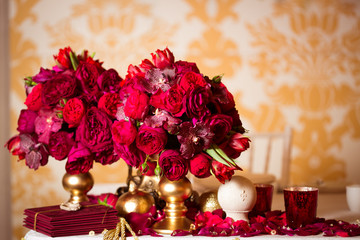 Beautiful bright bouquet of peony on the wedding table in vase