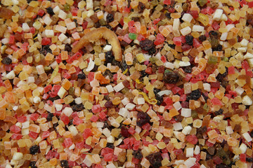 assortment of colored dried fruit diced in the market. Colored dry fruit background.