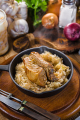 Traditional spare ribs baked in sauerkraut.