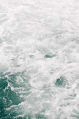seething sea foam from a wave that broke on a rock. natural sea background