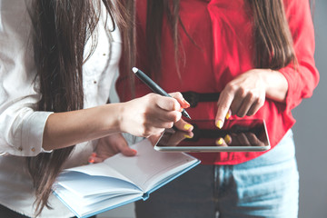 womans hand tablet with notepad