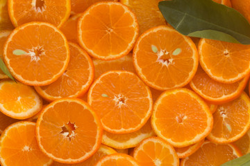 Round unpeeled orange slices background 