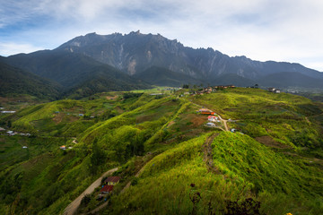 Farming village and Mount Kinabalu view from Sosodikon Hill. Kundasang Sabah.