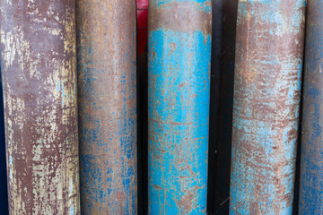 Discarded tanks of compressed oxygen in a warehouse for the collection of waste materials.