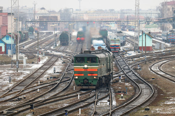 freight locomotive passes the railway station