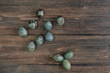 Quail eggs on wooden background