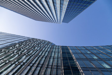 Fototapeta na wymiar Two business skyscrapers in city - bottom view