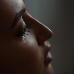Macro tears eye lashes. The girl is crying. Sadness is trouble chagrin depression tragedy loss...