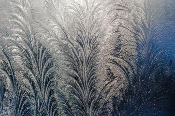 Beautiful ice pattern on winter glass, natural texture. Background.