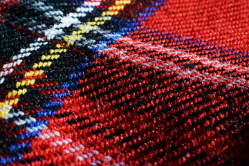 Red tartan fabric close up 