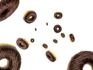 Donut cookies. Chocolate glazed sweet doughnut in motion falling on white background. Sweet icing sugar food.