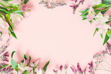 Obraz na płótnie Canvas Pink background with spring flowers, festive composition for spring holidays