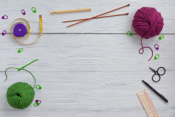 Background with knitting and crocheting tools and accessories for starting a project