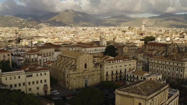 Cinematic flying on an early sunny morning over an old Baroque Church in the historic part of Palermo. Aerial shoot