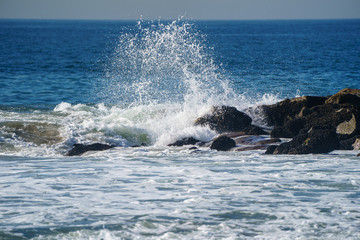waves crashing on rocks