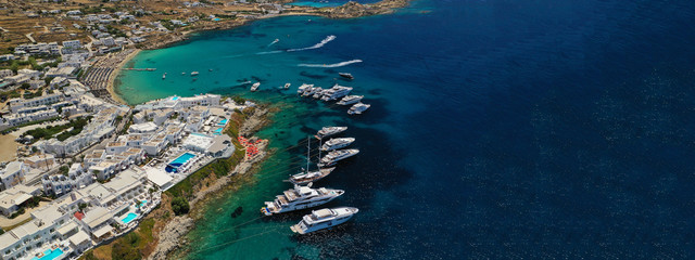 Aerial drone ultra wide photo of famous celebrity beach of Psarou in island of Mykonos, Cyclades,...