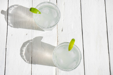 Mexican lime margarita cocktail on white background