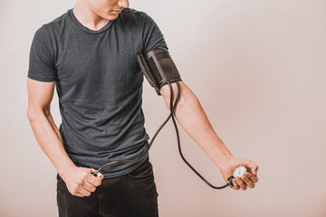 young man taking blood pressure