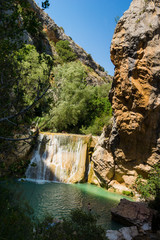 waterfall of the dam near Alquezar, Huesca Spain place to bathe in the river