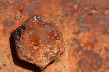 Fototapeta premium Close up and background of a rusty old screw on a rusty iron plate with room for text