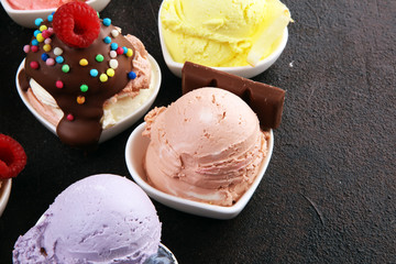 Various of ice cream flavor whit fresh blueberry, strawberry, kiwi, lemon, vanilla setup on rustic background . Summer and Sweet cold ice cream