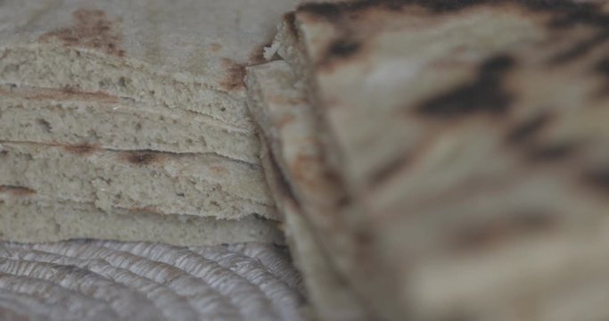 arabic barley flat bread, Flatbread homemade and fresh from the oven, Moroccan Pita Bread (Batbout), berber bread (toghrift ntomzine), Arabic bread cut and ready to use