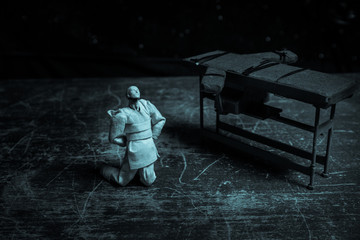 Prisoner handcuffed to death by lethal injection, vial with sodium thiopental and syringe on top of...