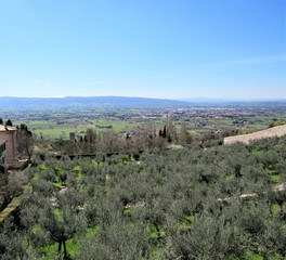 View from an overlook at hills, valleys, and towns as seen from Assisi, Italy