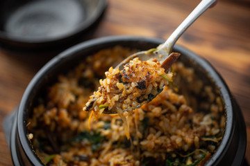 making crispy rice with korean hot stone bowl bibimbap