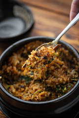 making crispy rice with korean hot stone bowl bibimbap