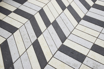 Grey and white tile pattern on ground at a mall
