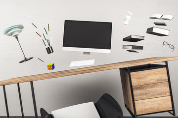 Minimalistic workplace interior with jumping computers