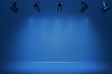 Illuminated bluevstage with spotlight. - obrazy, fototapety, plakaty