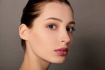 Fototapeta premium Close-up the face of a young beautiful white girl.