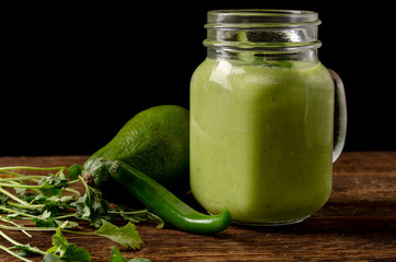 Green smoothie vegetables on the black