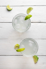 Mexican lime margarita cocktail on white background
