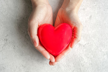 hand carrying heart .love and cardio health concept.valentine and wedding theme.