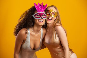 Beautiful women dressed for carnival night. Smiling women ready to enjoy the carnival with a...