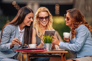 Business women in a meeting using tablet