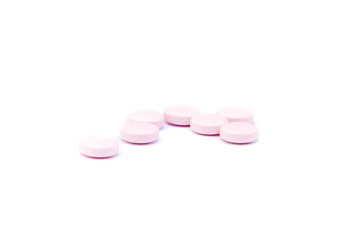 Obraz na płótnie Canvas Pink pills macro isolated on white background
