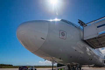 Fototapeta na wymiar Passenger Airplane Closeup Under A Sunny Sky