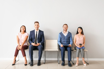 Young people waiting for job interview indoors