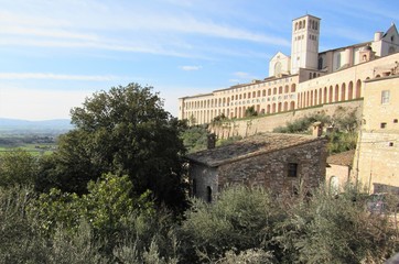 Fototapeta na wymiar View of the Basilica of Saint Francis of Assisi on the hill in Assisi, Italy on a sunny day