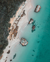 Aerial shot of a beach and blue water