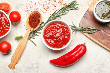 Different tasty sauces on white background